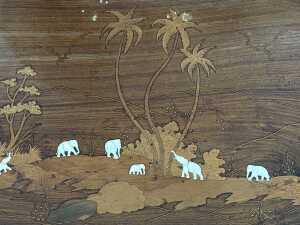 Timber coffee table with intricate inlay elephant and palm tree scenes - 3