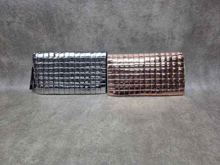 Two designer-style clutch purses