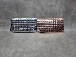 Two designer-style clutch purses