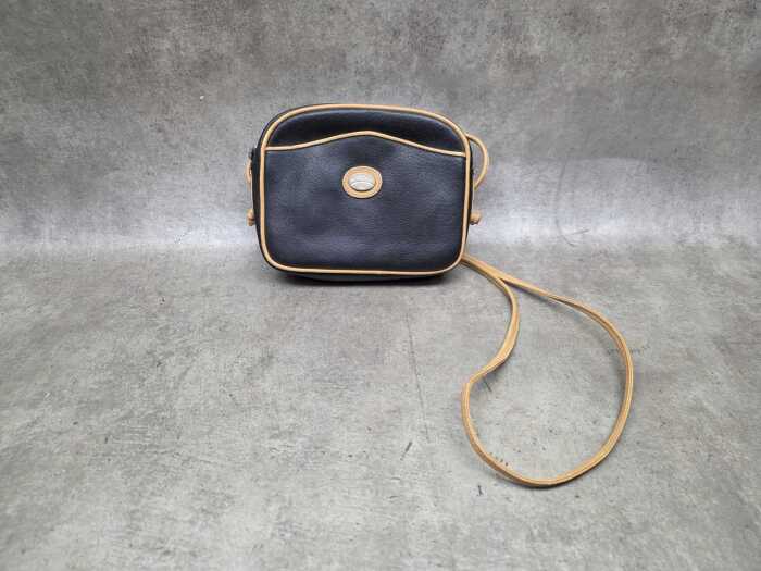 Designer-style black and tan leather crossbody bag