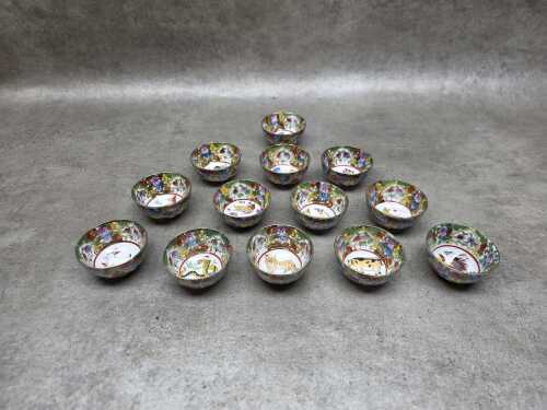 Set of thirteen Chinese famille rose zodiac tea cups
