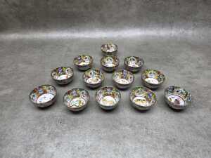 Set of thirteen Chinese famille rose zodiac tea cups