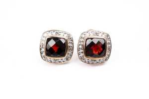 A pair of garnet and diamond earrings in 9 carat yellow gold