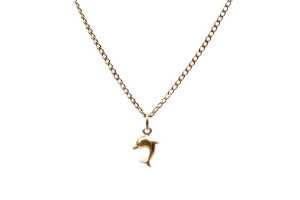 A dolphin pendant on curb link necklace in 9 carat yellow gold