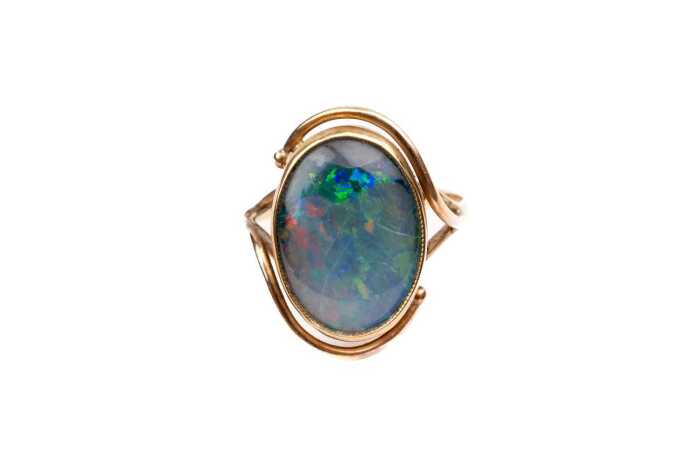 A damaged opal triplet ring in 9 carat yellow gold