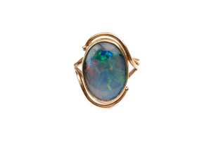 A damaged opal triplet ring in 9 carat yellow gold