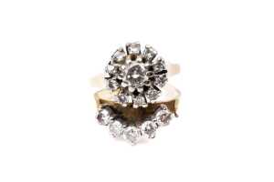 A broken soldered two diamond ring set in 18 carat and platinum