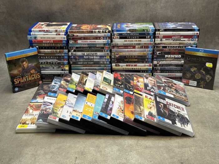 DVDs and Blu-rays, mostly movies, including Barbie