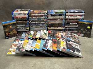 DVDs and Blu-rays, mostly movies, including Barbie