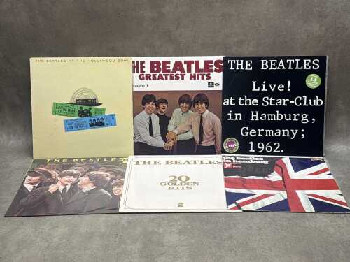Six Beatles vinyl records, including 'Greatest Hits: Volume 1'
