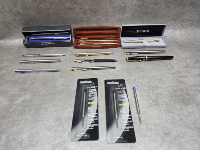 Mainly ballpoint pens, including Parker