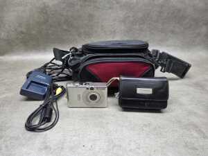 Canon IXUS55 digital camera with charger, SD card and soft case.