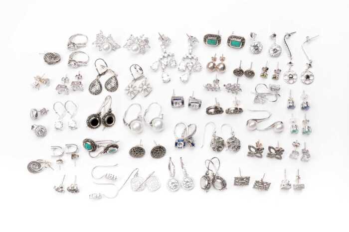 A large collection of earrings in sterling silver
