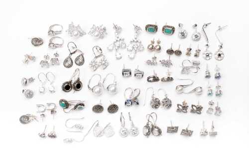 A large collection of earrings in sterling silver