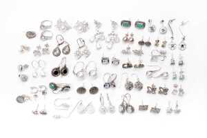 A large collection of earrings in sterling silver