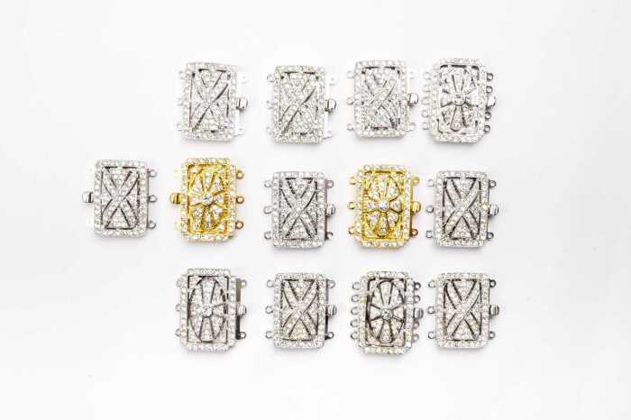 Thirteen multi strand clasps in sterling silver