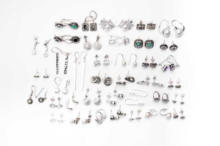 A large collection of earrings in sterling silver