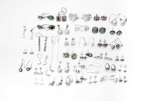 A large collection of earrings in sterling silver