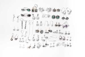 A large collection of earrings in sterling silver