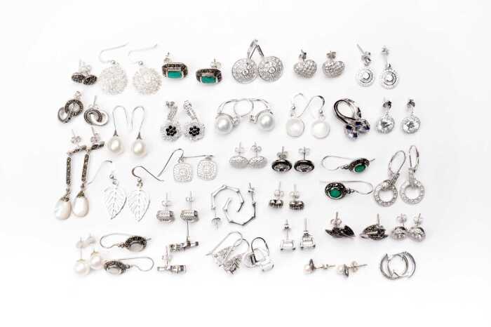 A large collection of earrings in sterling silver