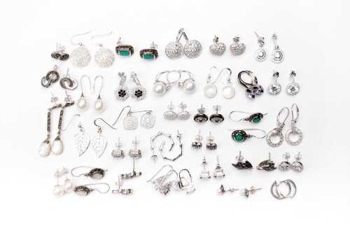 A large collection of earrings in sterling silver