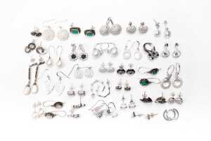 A large collection of earrings in sterling silver
