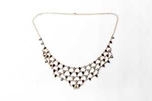 A garnet necklace in gold plated sterling silver