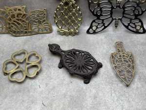 Seven metal trivets - 2