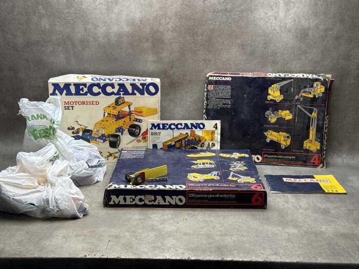 Three Meccano sets and assorted pieces