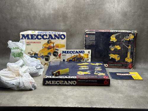 Three Meccano sets and assorted pieces