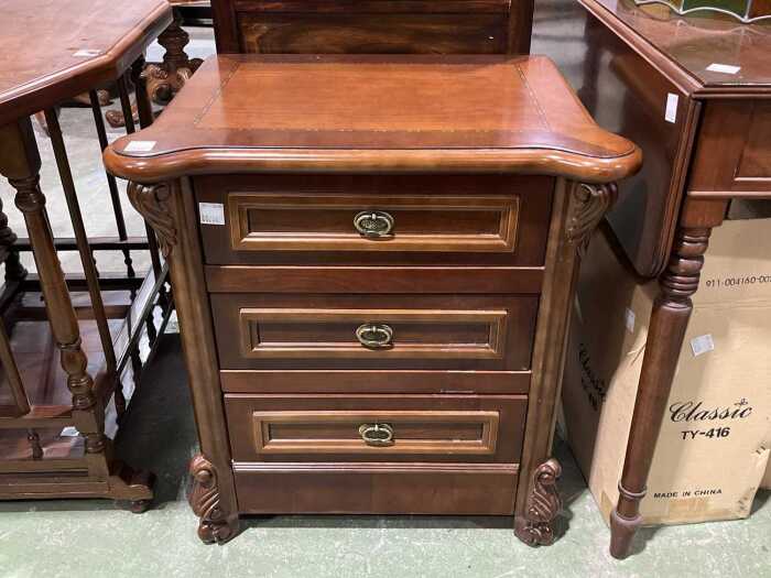 Carved three drawer bedside chest