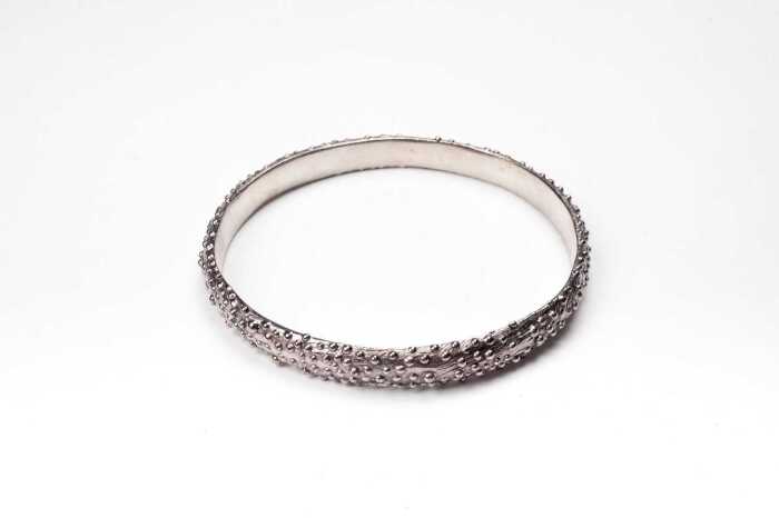 A Debra Fallowfield Kina sea urchin bangle in sterling silver