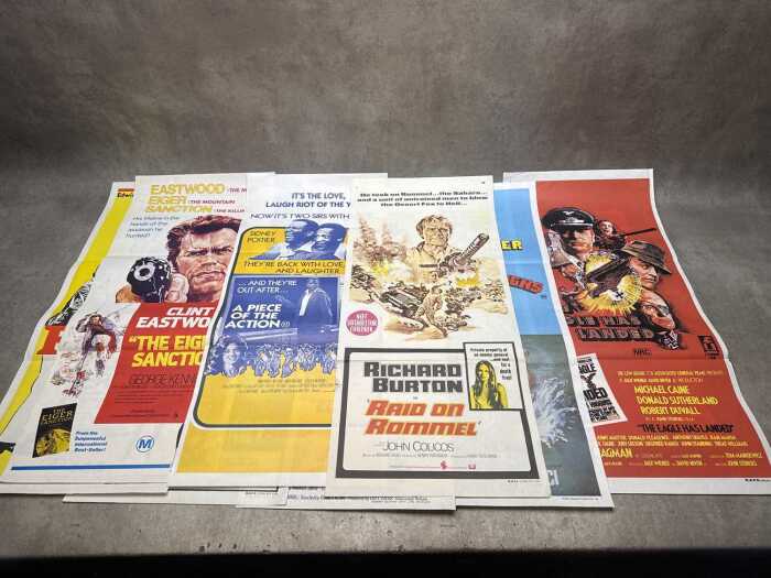 Nine vertical insert movie posters, including The Eiger Sanction