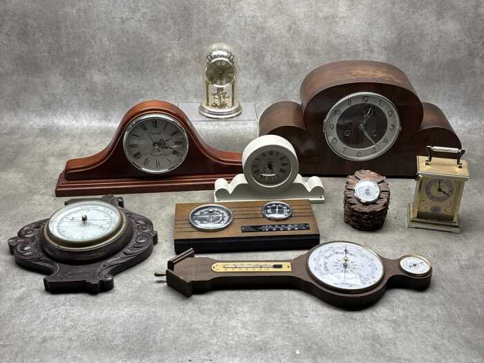 Group of clocks and barometers including mantel clocks