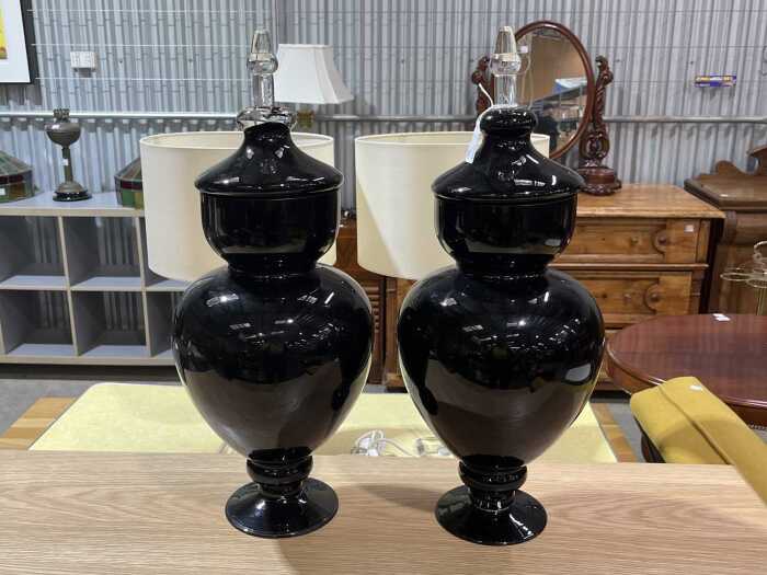 Pair of decorative amethyst glass apothecary jars with clear glass finials