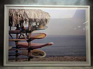 Contemporary photographic print of rack of surfboards