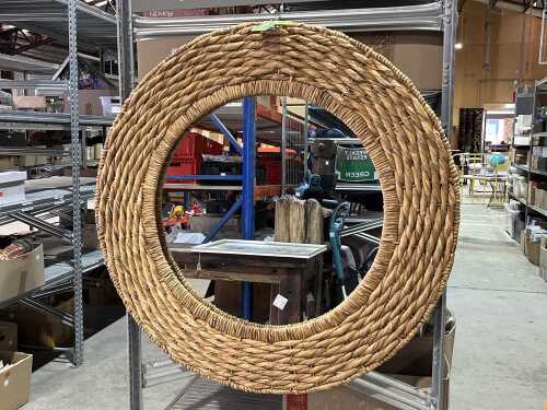 Round wall mirror in woven wicker frame