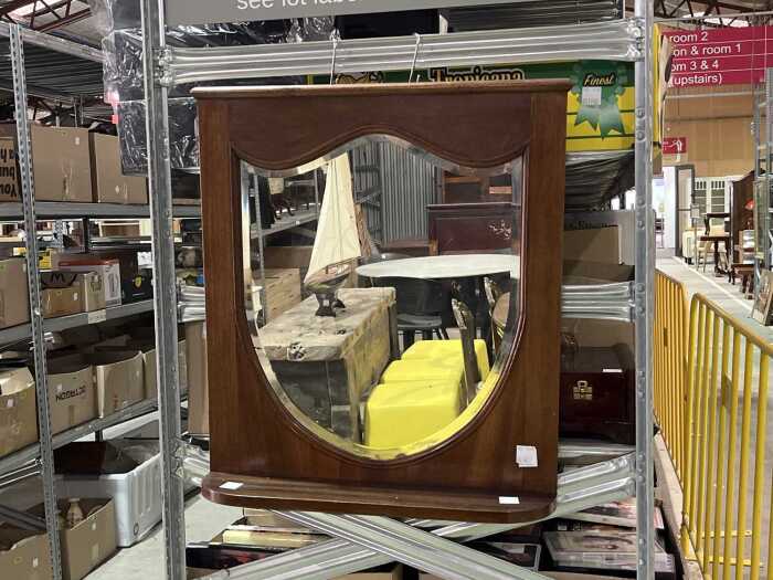 Timber mirror featuring an arched design and built-in wall shelf