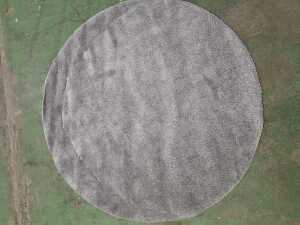 Machine-made synthetic circular shag pile rug