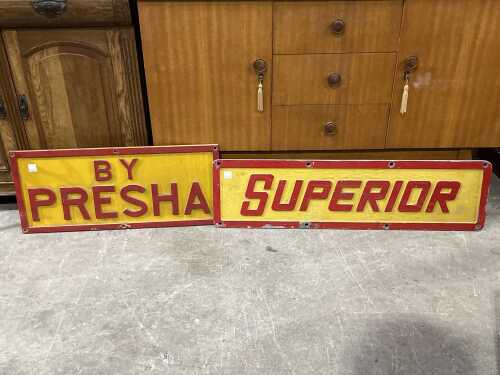 Two yellow and red painted cast metal signs