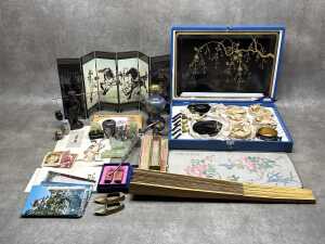Oriental decorative items including carved green stone elephants, cloisonne vases,