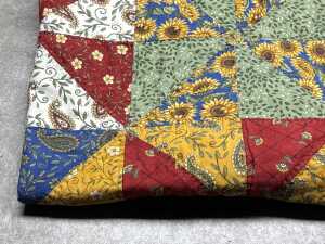 Patchwork blanket with hand-stitching in blue, red and yellow - 2
