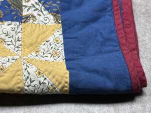 Patchwork blanket with hand-stitching in blue, red and yellow - 3