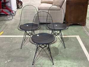 Set of three black Eames wire chairs