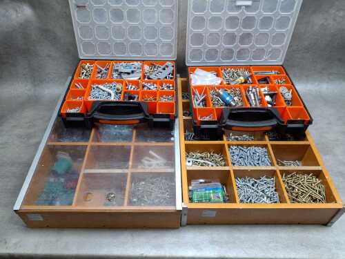 Four tool organisers filled with assorted screws, wall plugs, and bolts