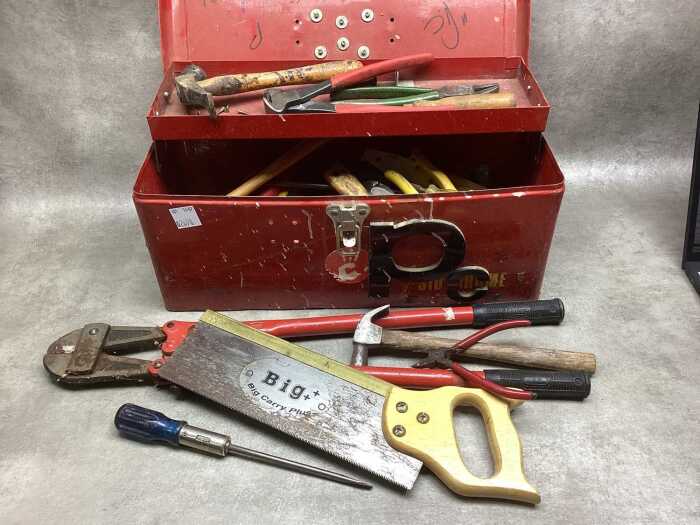 Metal toolbox with assorted handyman tools