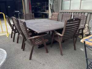 Nine-piece teak outdoor dining setting