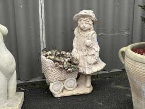 Concrete statue pot with ground cover plant
