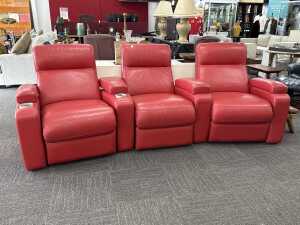 Set of three red electric leather home theatre recliners with cup holders