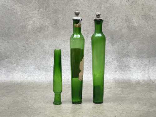 Three antique French green glass perfume bottles